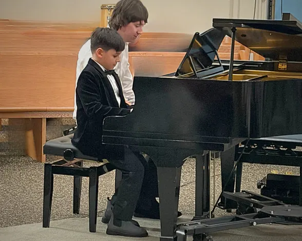 Azars' Music School student performing piano