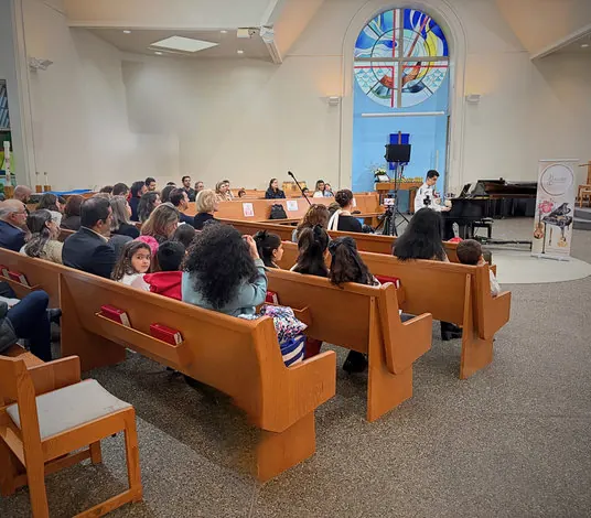Families watching an Azars' Music School student recital