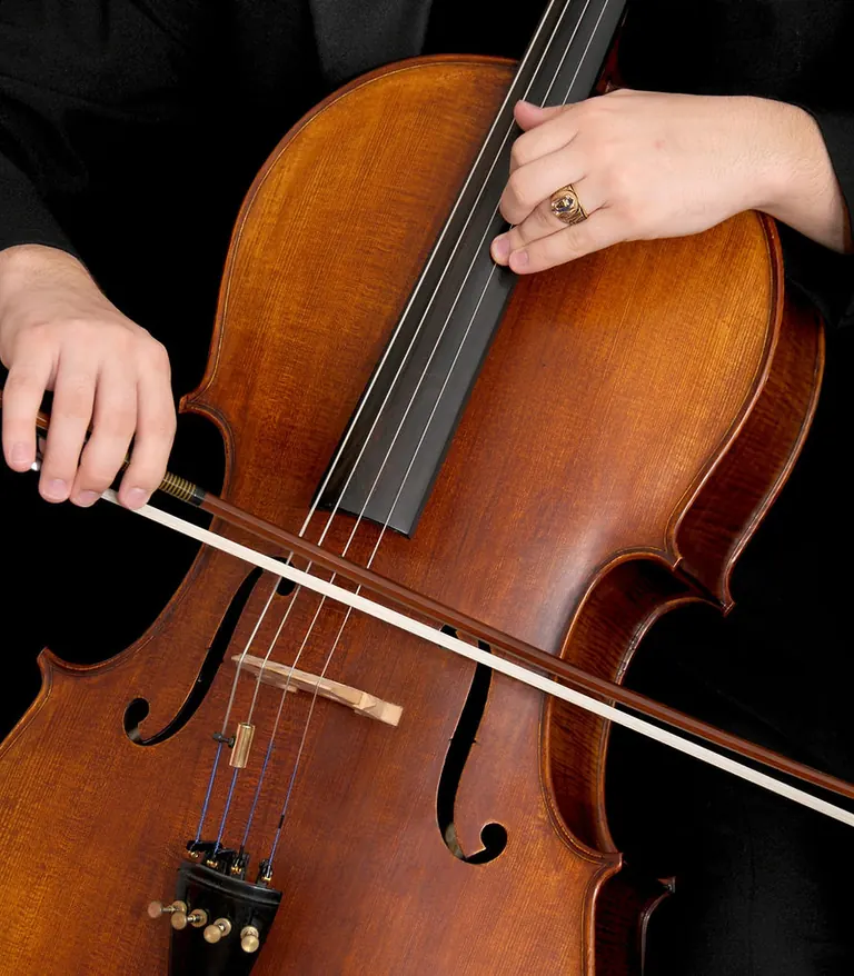 Cellist playing cello for cello lessons